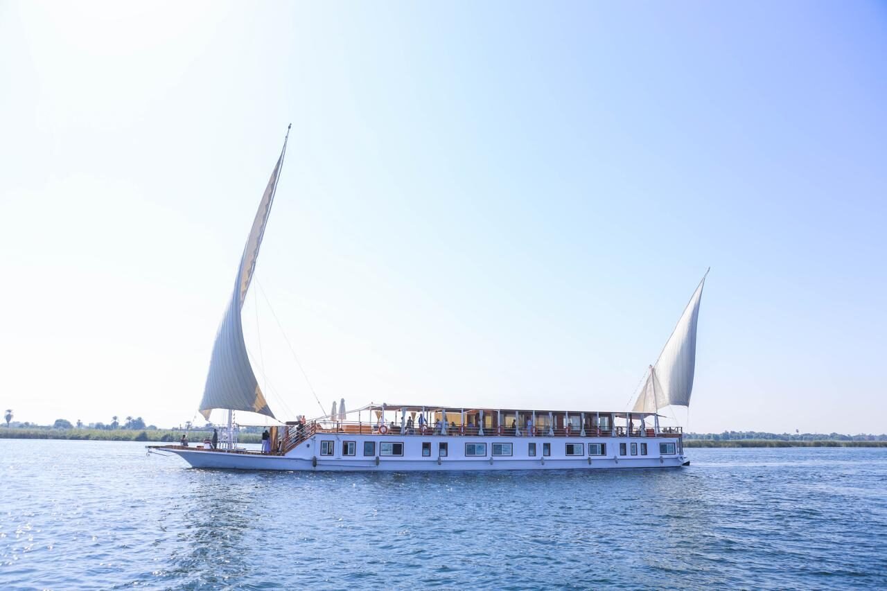NR-HM dahabiya sailing on the Nile with traditional sails
