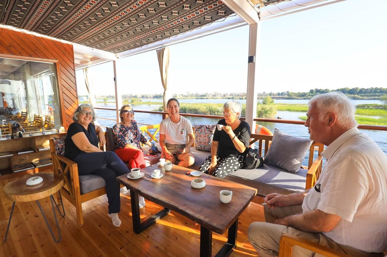 NR-HM dahabiya deck seating with guests enjoying a private Nile journey