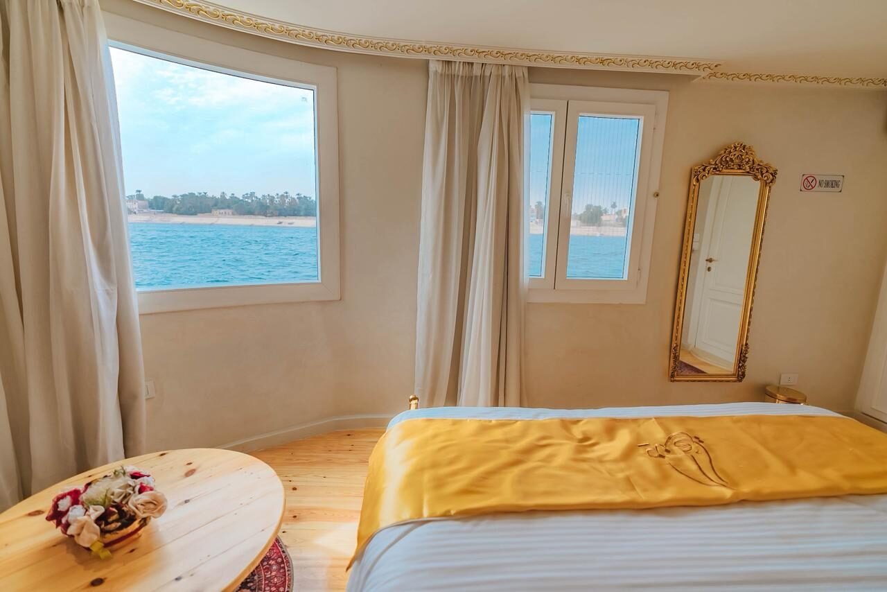 NR-KZ private dahabiya cabin with Nile view and soft classic interior