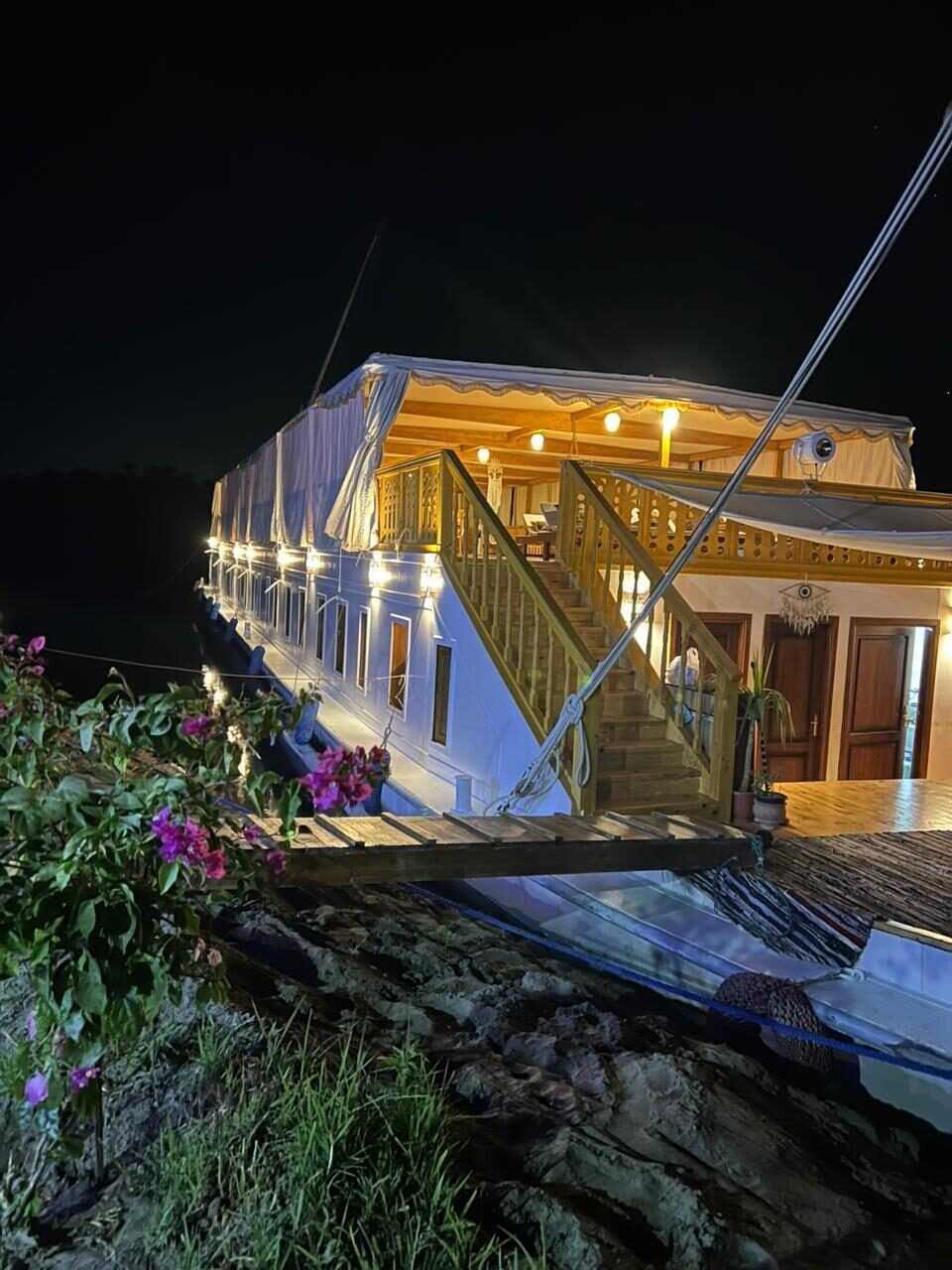 NR-RZ dahabiya at night with warm lighting and evening Nile atmosphere