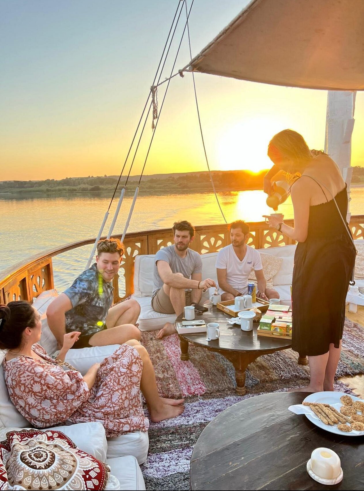 NR-RZ dahabiya guests enjoying sunset deck time on the Nile