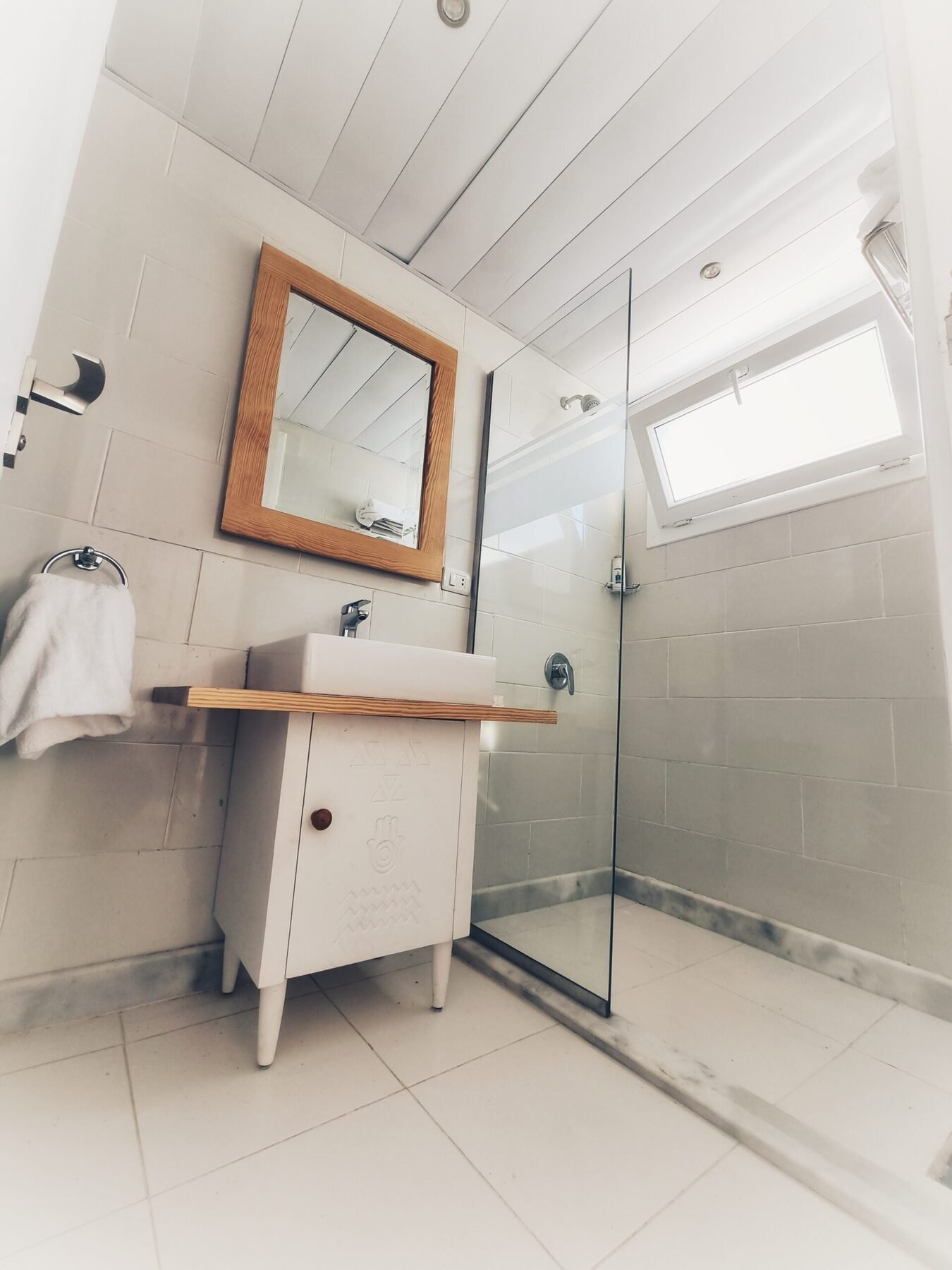 NR-SF dahabiya bathroom with sink, mirror, shower area, and bright onboard comfort